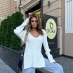 Knitted sweater with slits